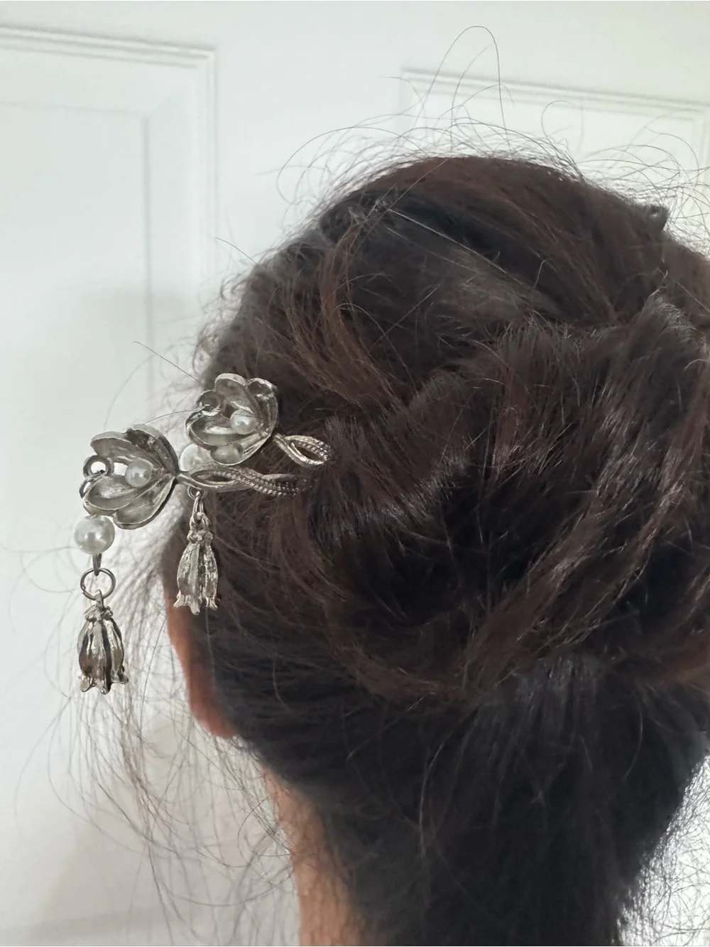 Hairpin is a silver toned